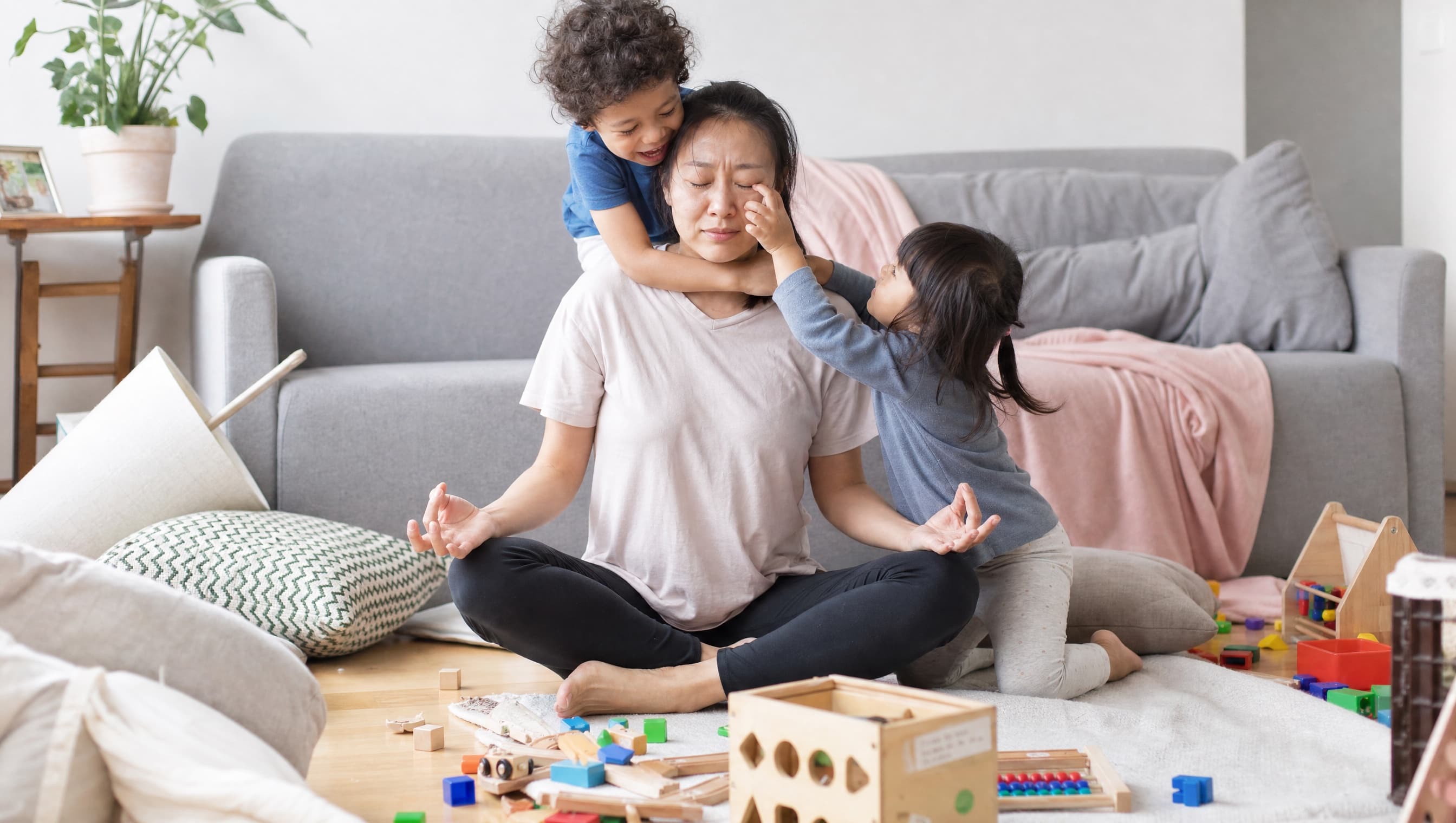 A parent and child sitting quietly together on the couch